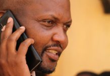 Gatundu MP Moses Kuria speaking on the phone