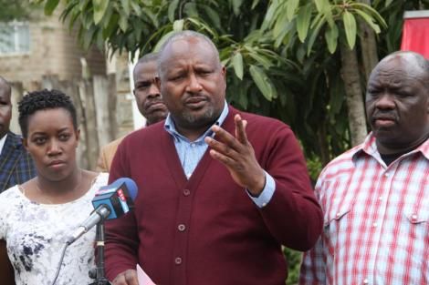 Nick Salat (centre) addressing the media in June 2018.