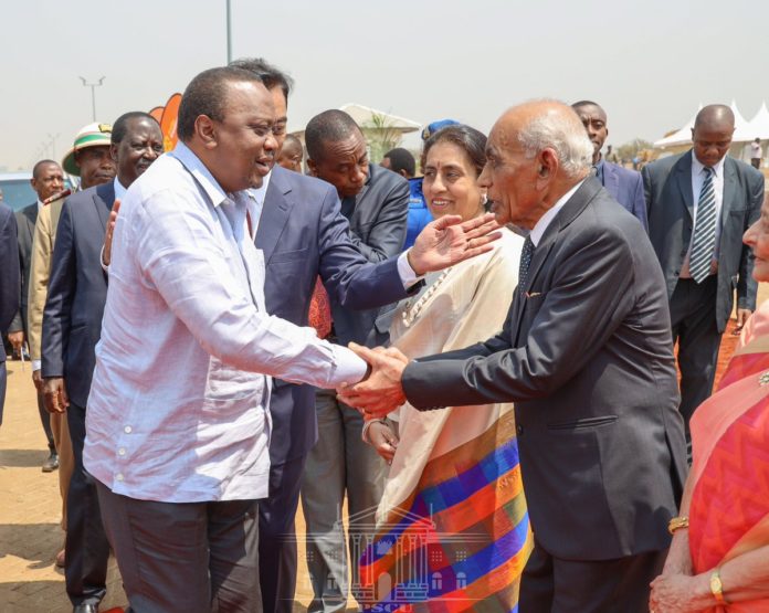 File image of President Uhuru Kenyatta and Bhimji Depar Shah. |Courtesy| PSCU|