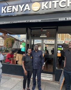 ODM Leader Raila Odinga poses with Kenya Kitchen proprietor Margaret Smalls.