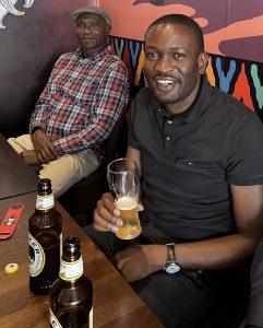 Nairobi Senator Edwin Sifuna enjoys a beer at the Kenya Kitchen in London, UK.