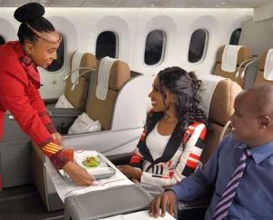 A KQ Charters crew member attends to customers. |Courtesy| KQ|
