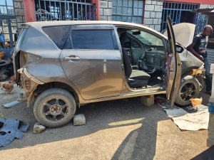 Stolen vehicles at Salesio Njagi Kiura's compound in Kamulu. |Courtesy| DCI|