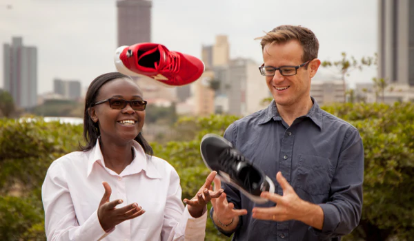 File image of Enda Sportwear founders Navalayo Osembo Ombati and Weldon Kennedy holding running shoes. |Courtesy| Enda|