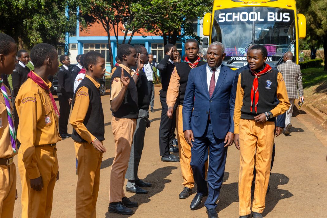  Equity Group Managing Director and CEO, Dr. James Mwangi inspects a guard of honour mounted by the Alliance High School scouts.
