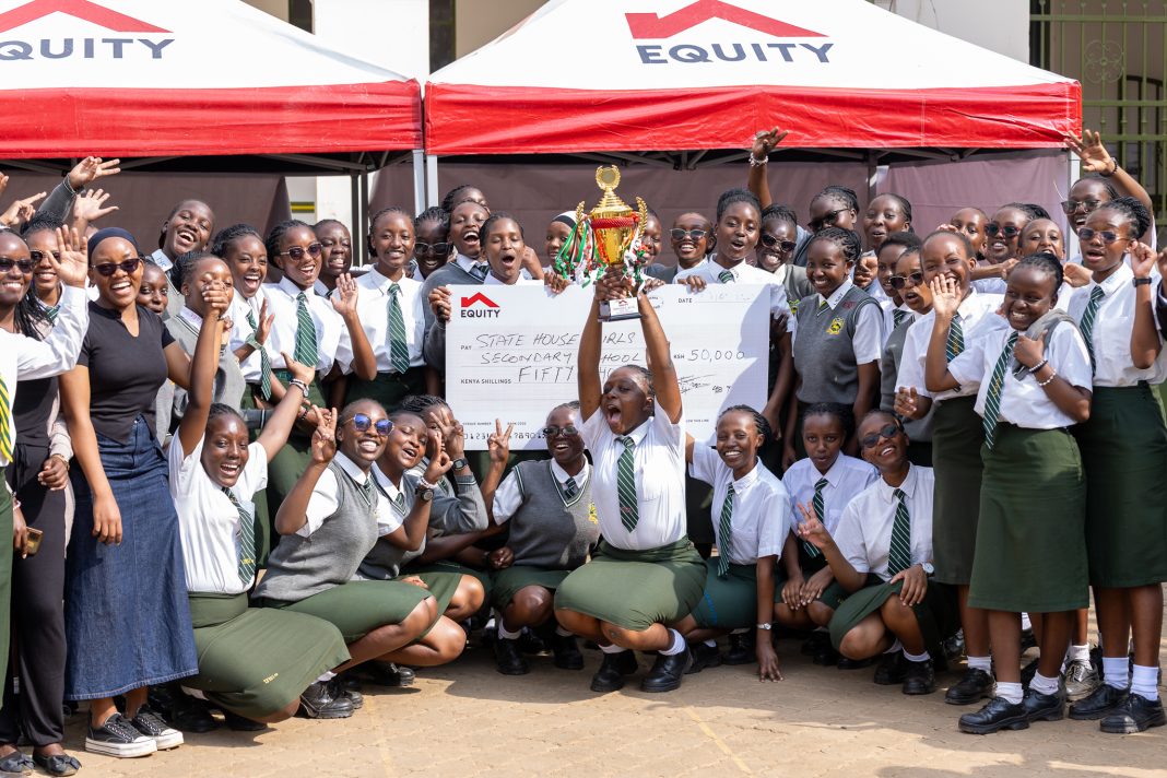 Statehouse Girls celebrate winning Ksh50,000 and proceeding to the national music festivals, after showcasing an insurance themed musical piece at Jamhuri High School in Nairobi. 