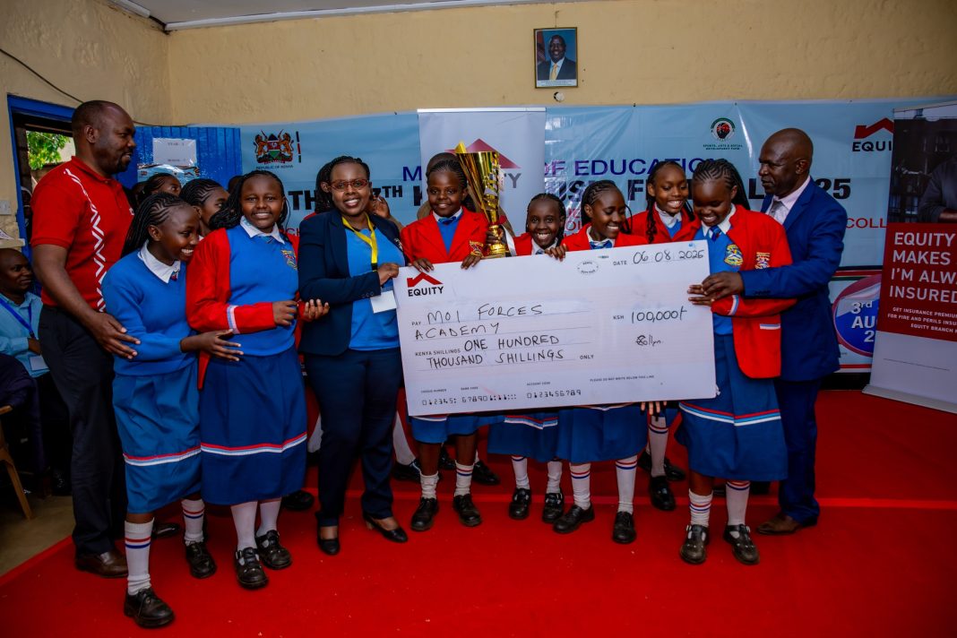 Moi Forces Academy students pose with a photo of dummy cheque presented by Equity Bank after emerging first in an insurance themed piece