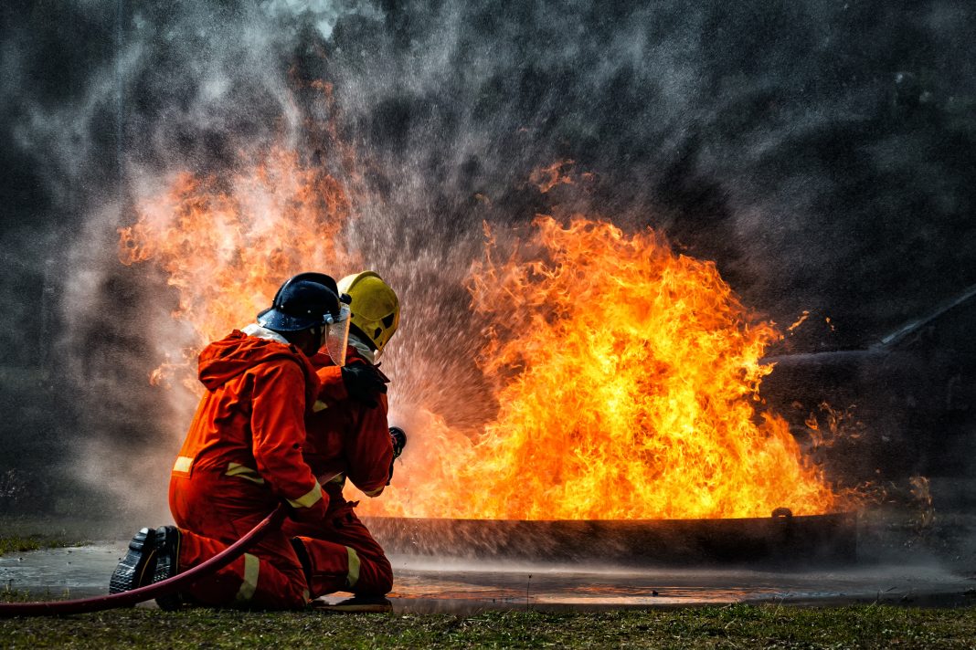 Fire fighters putting out a fire