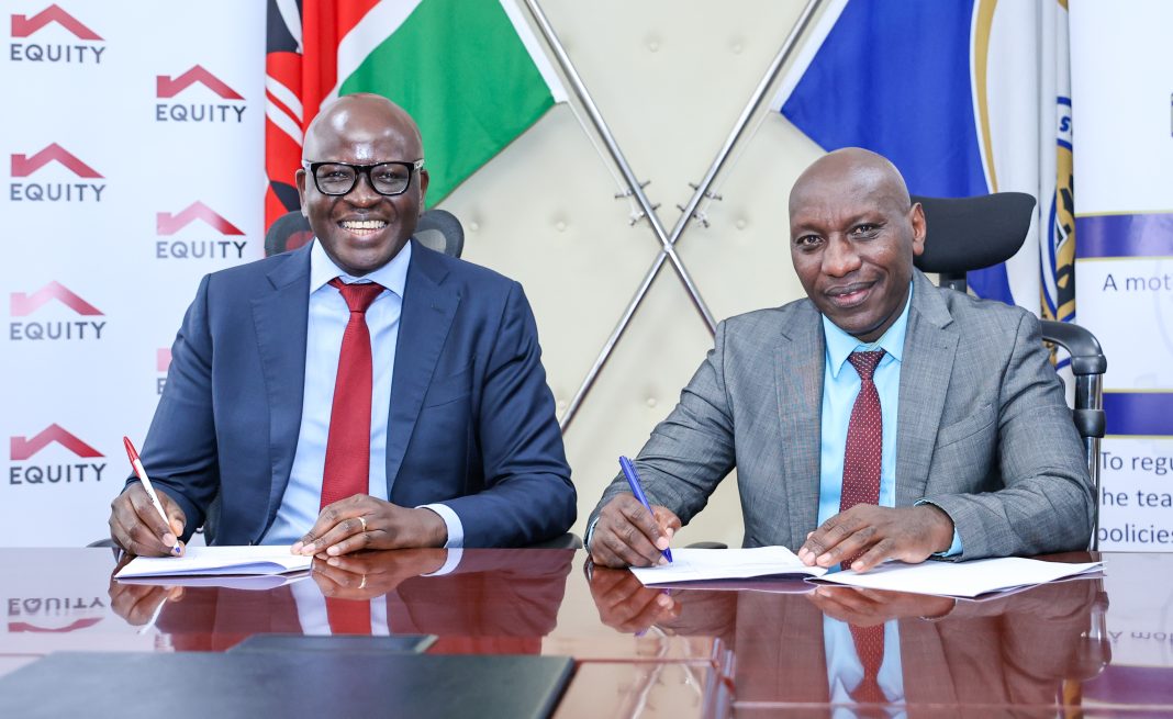 Equity Bank Kenya Managing Director Moses Nyabanda (left) and Teachers Service Commission Chairman Dr. Jamleck Muturi (right) sign an agreement to support TSC in celebrating World Teachers Day and equipping teachers with essential financial literacy and saving skills. Equity donated Ksh10 million for World Teachers Day celebrations. 