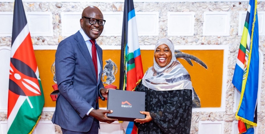 Equity Bank Kenya Managing Director, Moses Nyabanda, presents a gift hamper to Kwale County Governor Fatuma Mohamed Achani at her Kwale office during the meeting that focused on expanding partnerships between the Bank and Kwale County.