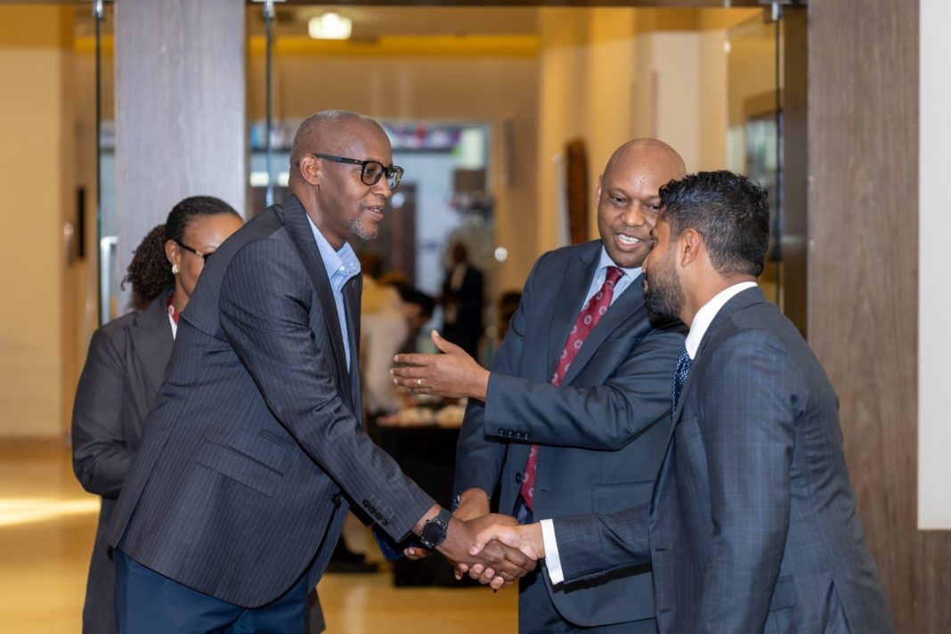 Equity Group Director for International Trade Relations, AQ Hamza (R), and Equity Bank Rwanda Managing Director, Hannington Namara (C), pictured with one of the delegates during the ongoing Rwanda trade mission hosted by Equity Group.