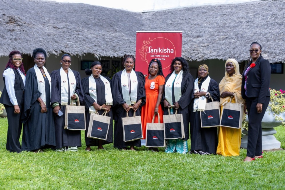 Equity Bank Kenya Senior Manager for Women & Youth Banking Charity Munyori (right) and Equity Bank Kenya Relationship Manager for Women & Youth Banking Celina Wandia (left) with a section of women drawn from Kwale County and financial literacy training graduates courtesy of Equity who attended the Coast Edition of Fanikisha Customer Engagement forum.