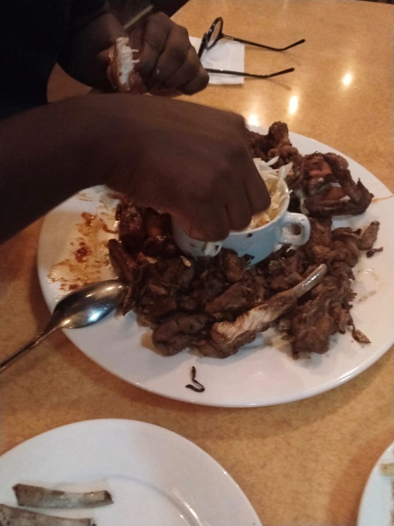 Junior Platter at Kitonga Garden Resort featuring goat meat, pork, and chicken.